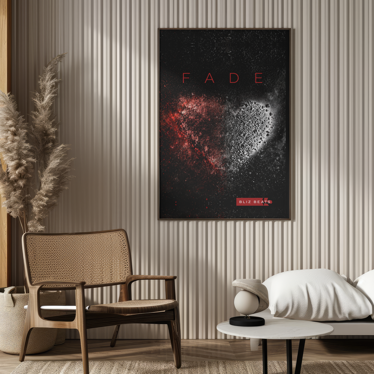 A framed wall art print featuring the word 'FADE' above a dark abstract design with red and white heart-like forms, displayed in a modern living room setting with a chair, sofa, and side table.